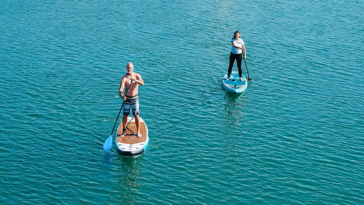 couple paddleboarding